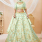 Pista green and gold-toned Embroidered Sequinned Semi-Stitched Lehenga & Unstitched Blouse With Dupatta