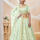 Pista green and gold-toned Embroidered Sequinned Semi-Stitched Lehenga & Unstitched Blouse With Dupatta
