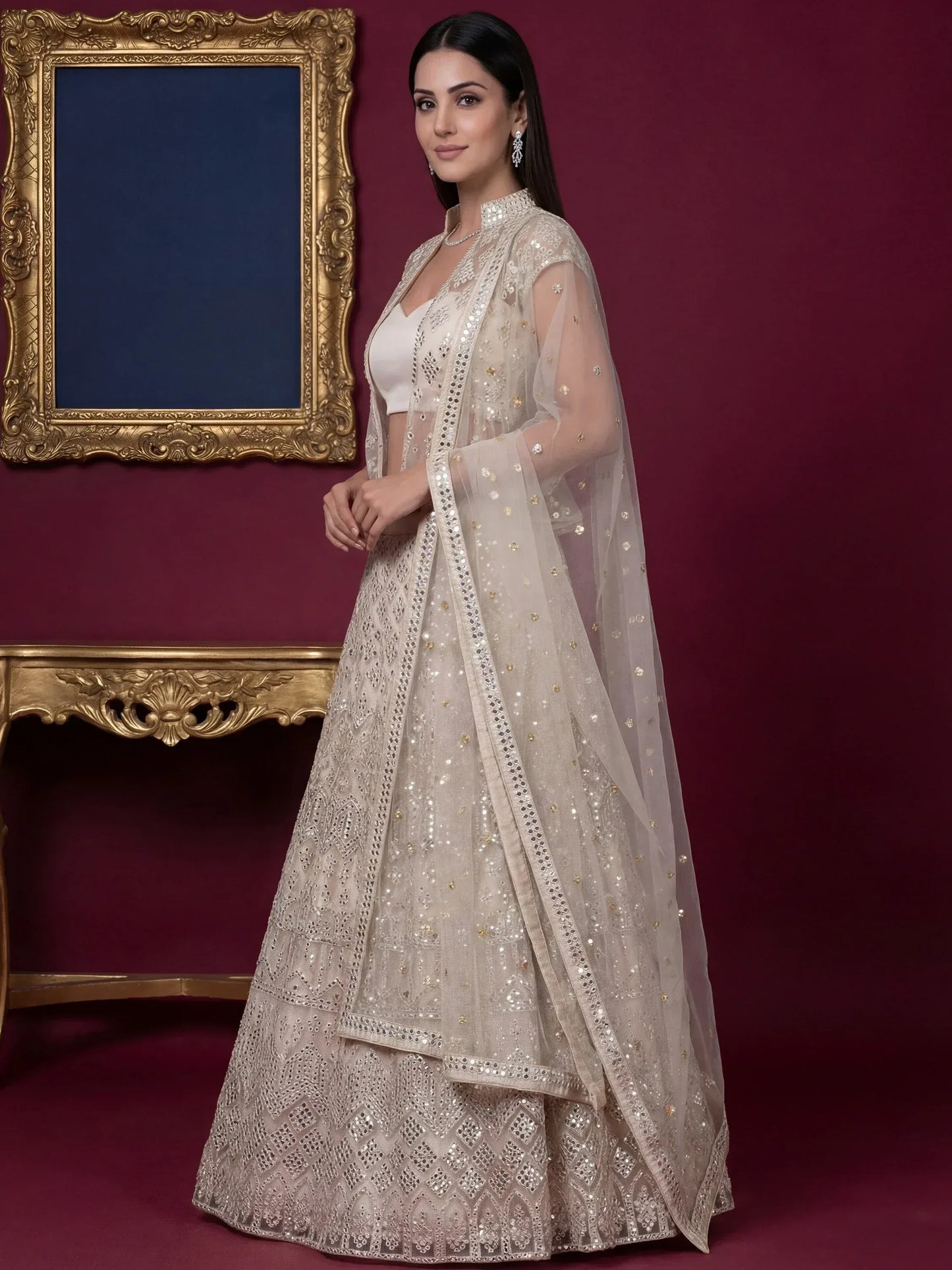 Beautiful Off-White Embroidered Net Party Wear Lehenga Choli