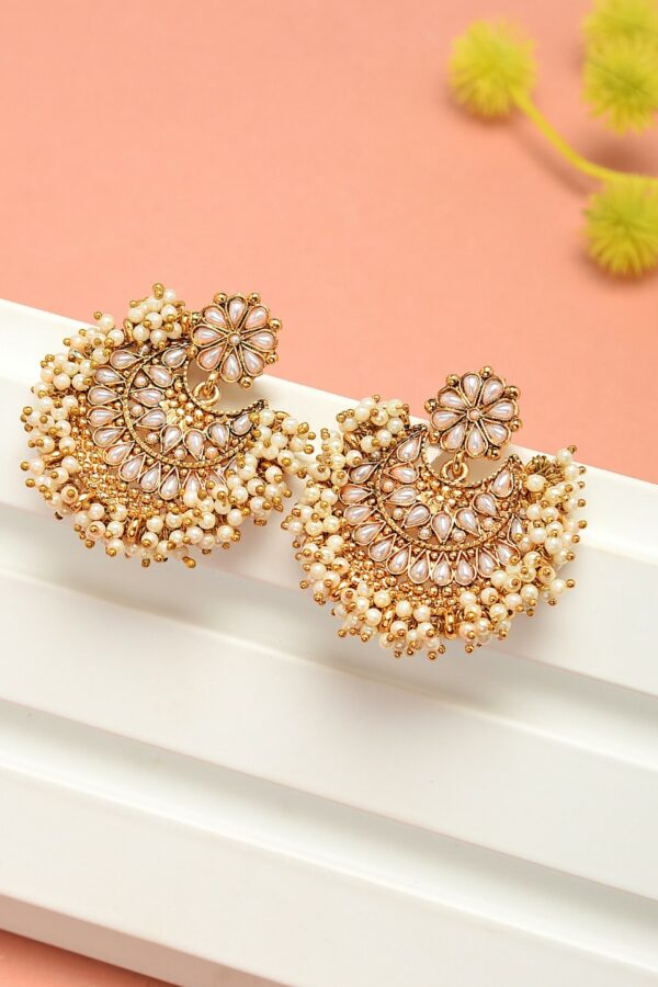 Zaveri Pearls Off-White Antique Gold-Plated Crescent Shaped Chandbalis