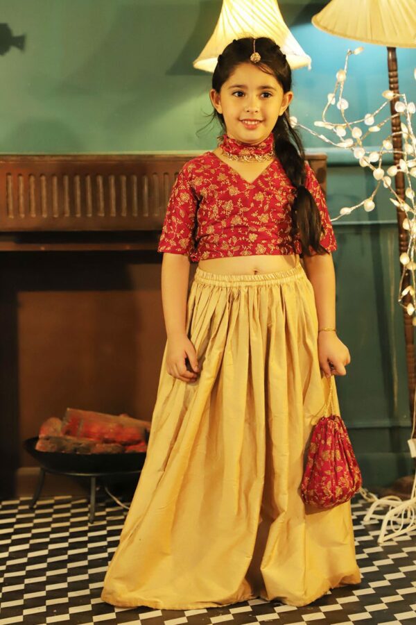 Girl's Pink Embroidered Top And Rose Gold Long Skirt Set With Pink Ornamented Matching Neckless And Potli Bag